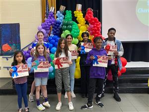 dance choreography winners standing at stage